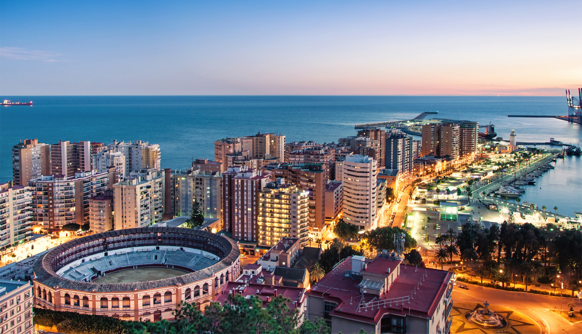 Panoramic cityscape of Malaga on the Costa del Sol showing Mediterranean coastline urban skyline and lifestyle appeal for foreign buyers considering property investment.