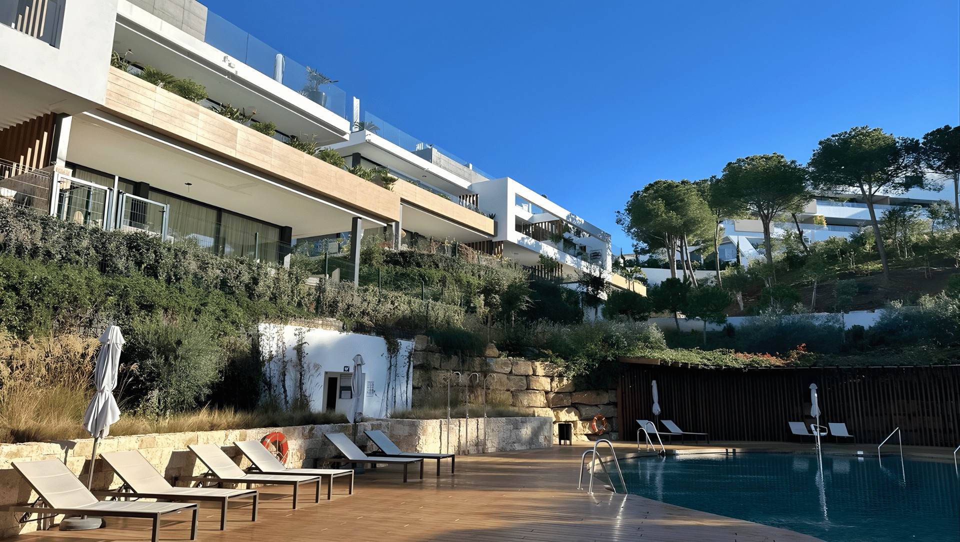 Cabopino marina in Marbella with waterfront apartments and boats, highlighting an emerging property hotspot for international buyers on the Costa del Sol